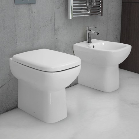 Sanitari filomuro bianco lucido con sedile origin rak ceramics